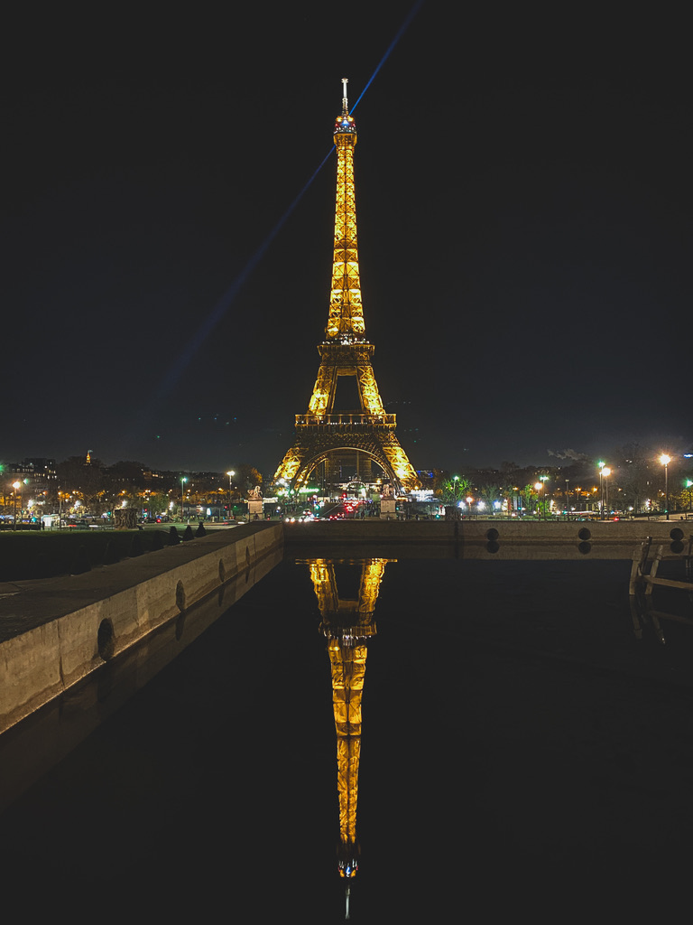 An illuminated symmetry cutting through the architectural dark.
