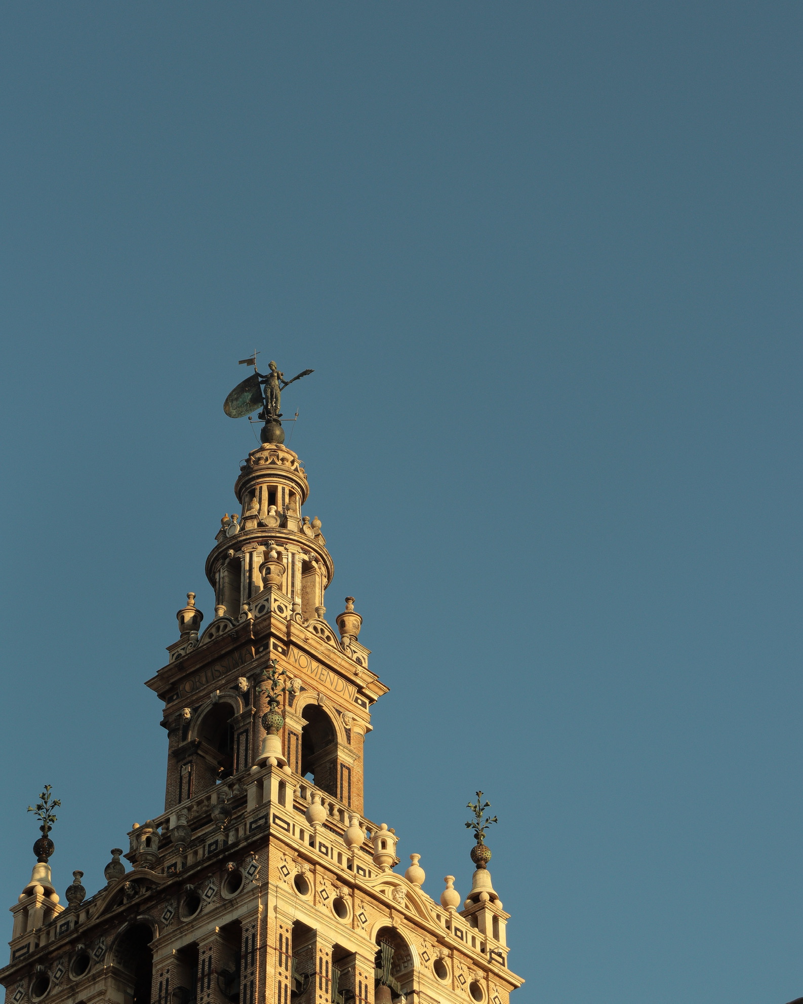 Ancient stone spire structures rising cleanly into deep negative space.