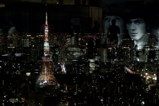 A double exposure of history appearing by accident across a living grid.